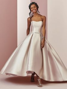 model walking with a champagne wedding dress example